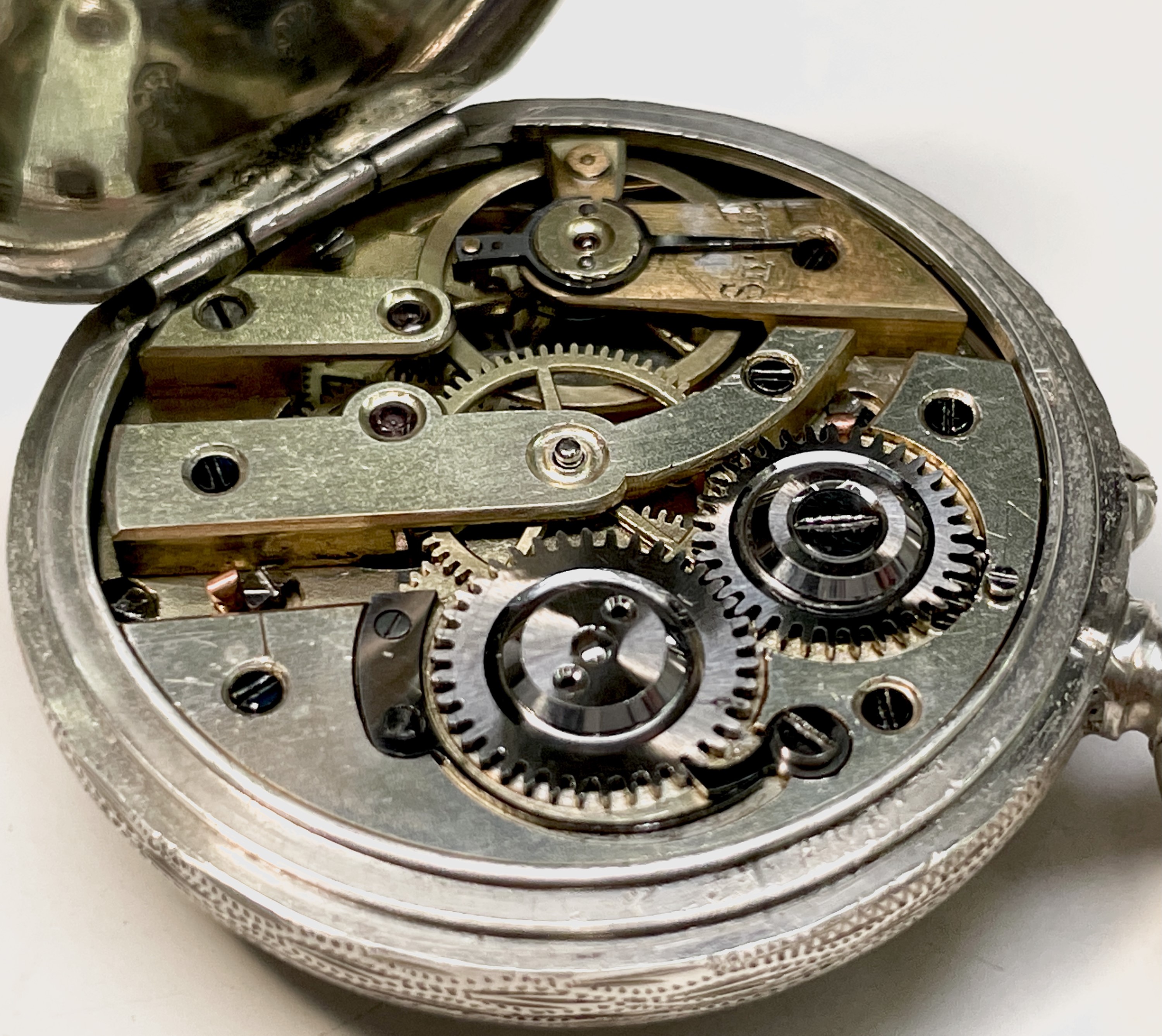 Ten silver cased keyless fob watches each with an ornamental dial and each with engraved decoration. - Image 11 of 60