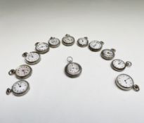 Twelve small silver keyless fob watches, each with plain or decorated enamel face.