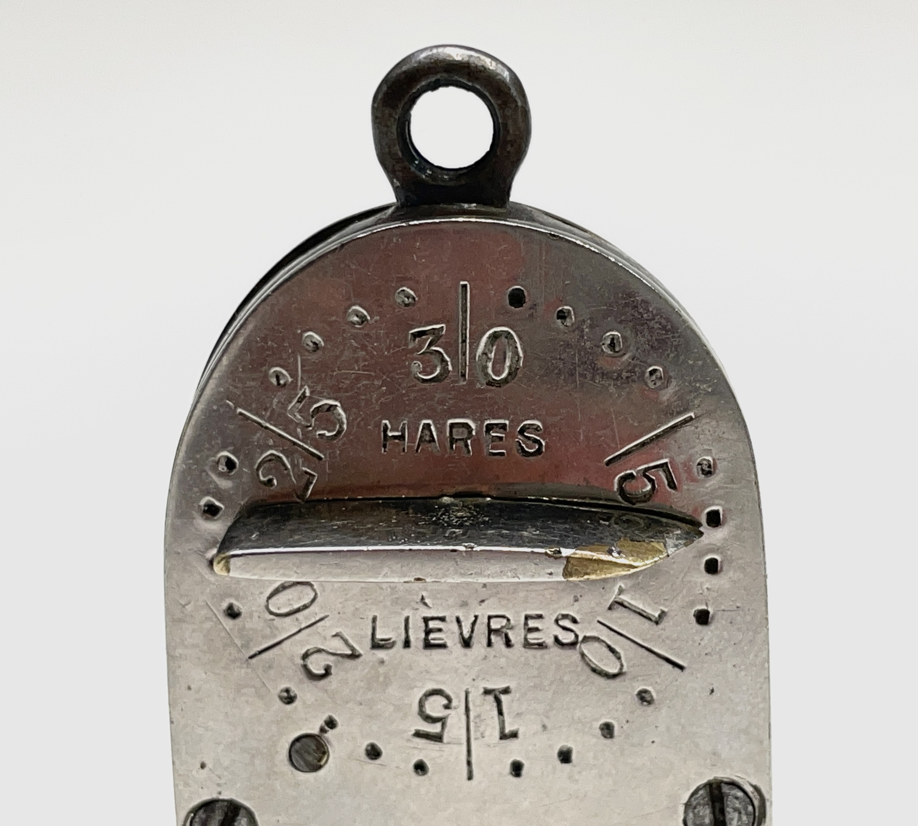 An Anglo-French game counter in blued steel, brass and nickel-plated brass, with four bi-lingual - Image 4 of 4