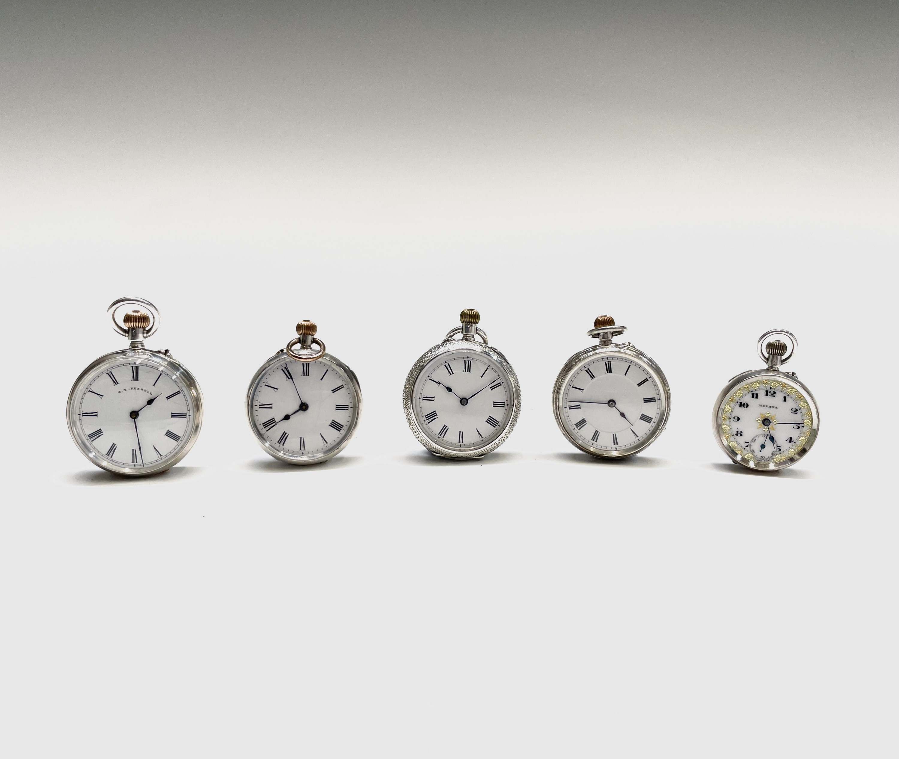 Four silver keyless fob watches with white open dials, including one by Russell together, all
