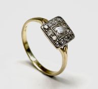 A prettily-set 18ct gold and diamond ring, the central diamond of approximately 0.15ct set in a