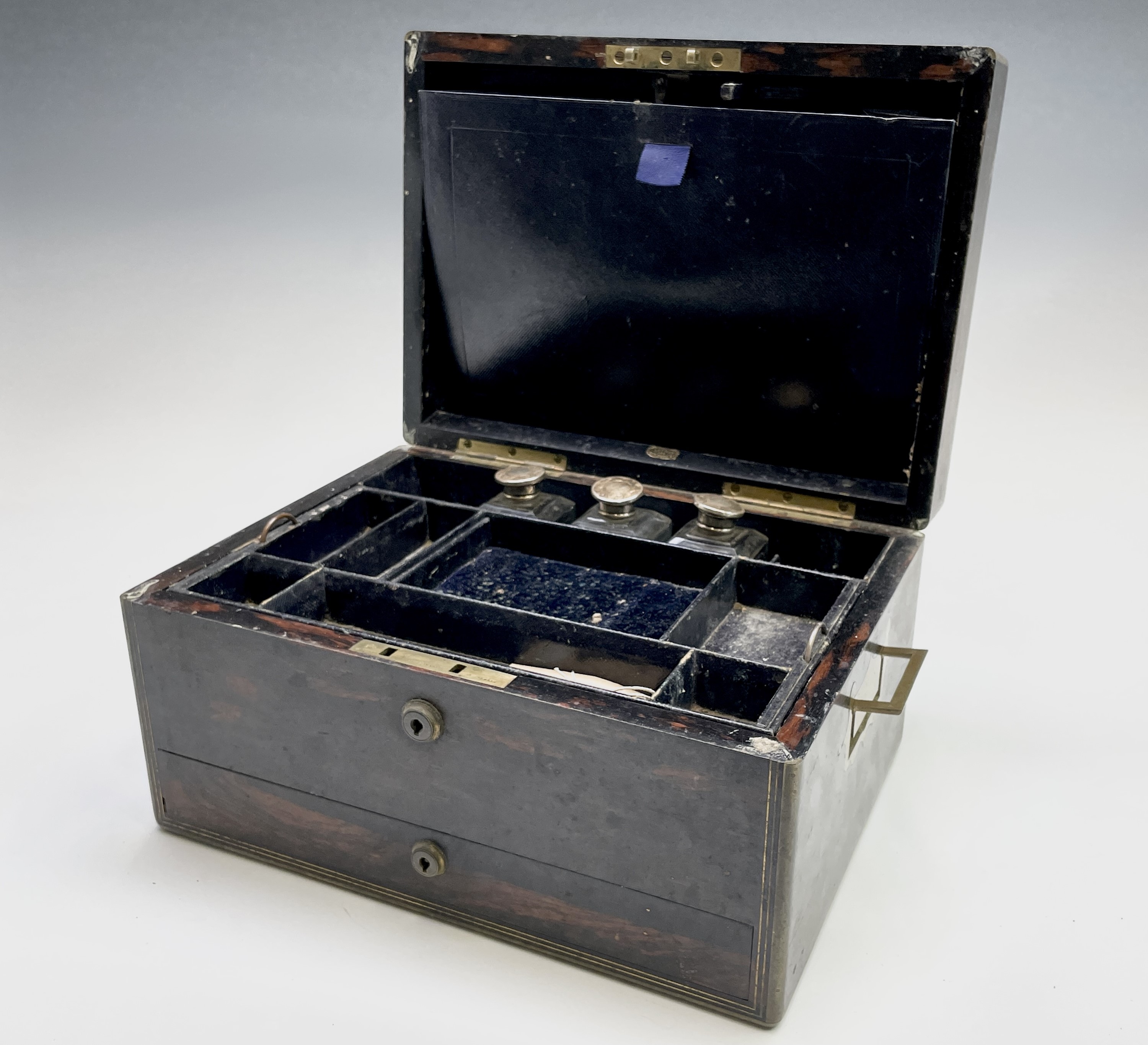 A Victorian coromandel toilet case by Asprey, the lockplates signed Mordan 33cm wide Condition: