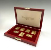 A set of seven silver-gilt replica stamps- 25th coronation anniversary 1978 173gm UK Postage: £19.56