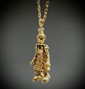 A gold gem-set articulated clown pendant on 9ct gold chain 12gm UK Postage: £17.04