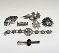 Four pieces of Asian silver filigree jewellery (29.3gm) together with three pieces of nielo silver