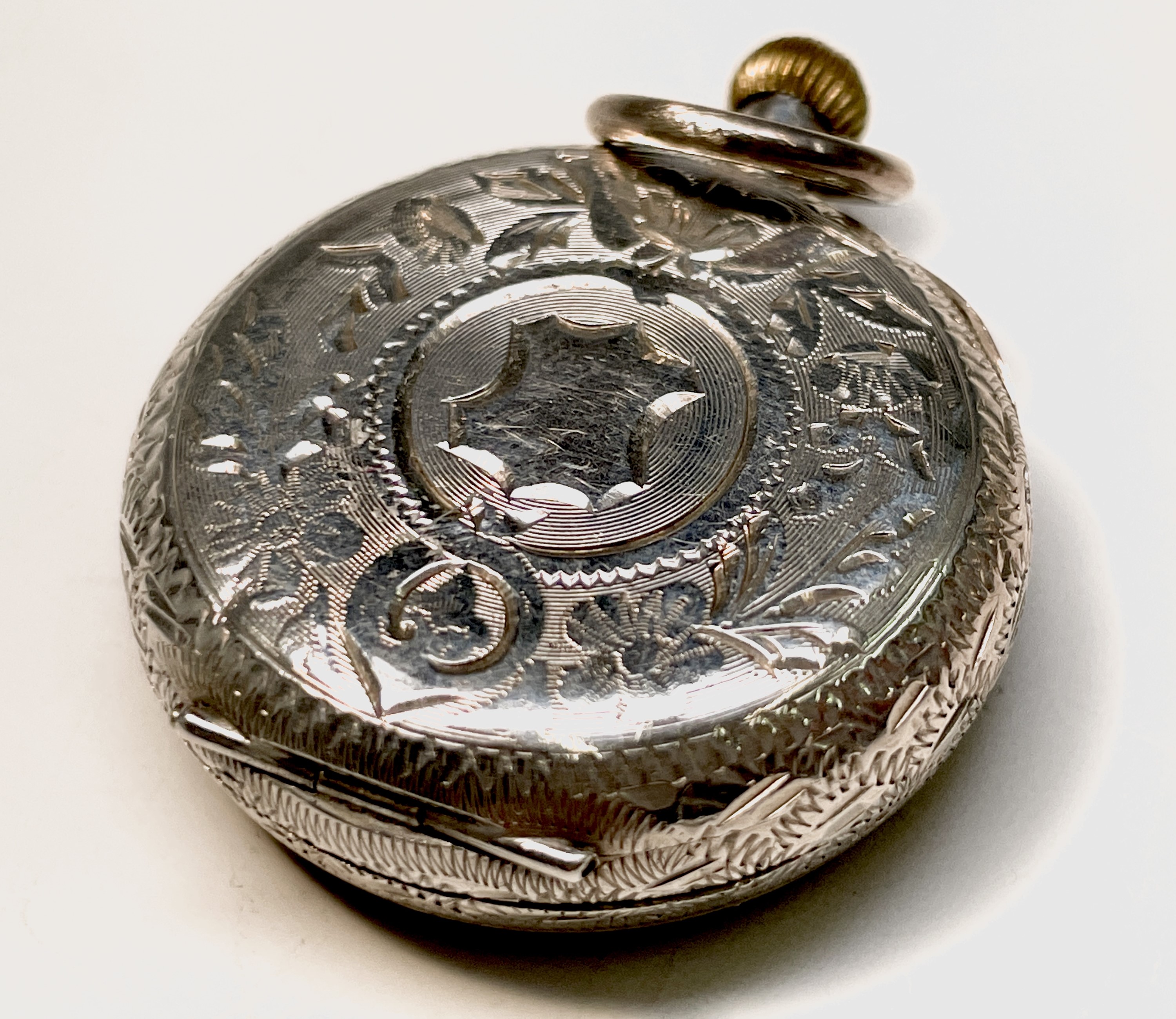 Ten silver cased keyless fob watches each with an ornamental dial and each with engraved decoration. - Image 5 of 60