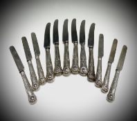 A set of six crested Victorian Kings Pattern silver desert knives by Francis Higgins II with