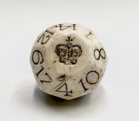 A walrus ivory gambling ball or Teetotum, probably 17th century, the multi-faceted ball numbered