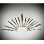 A set of 12 silver bladed desert knives by G W Shirtcliffe & Son Sheffield 1919 together with a