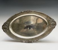 An Indian 900 standard silver tray, of eliptical form with applied decoration in the form of four