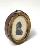 An 18th-century Naval Officer silhouette painted portrait heightened with white 4x3.5cm Condition: