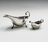 A Chester silver sauceboat in Georgian style 1929 3.5oz and a late Victorian half-fluted cream jug