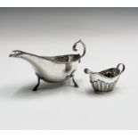 A Chester silver sauceboat in Georgian style 1929 3.5oz and a late Victorian half-fluted cream jug