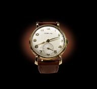 A gentleman's 9ct gold Garrard wristwatch with gold Arabic numerals diameter 33.11mm 32.7gm