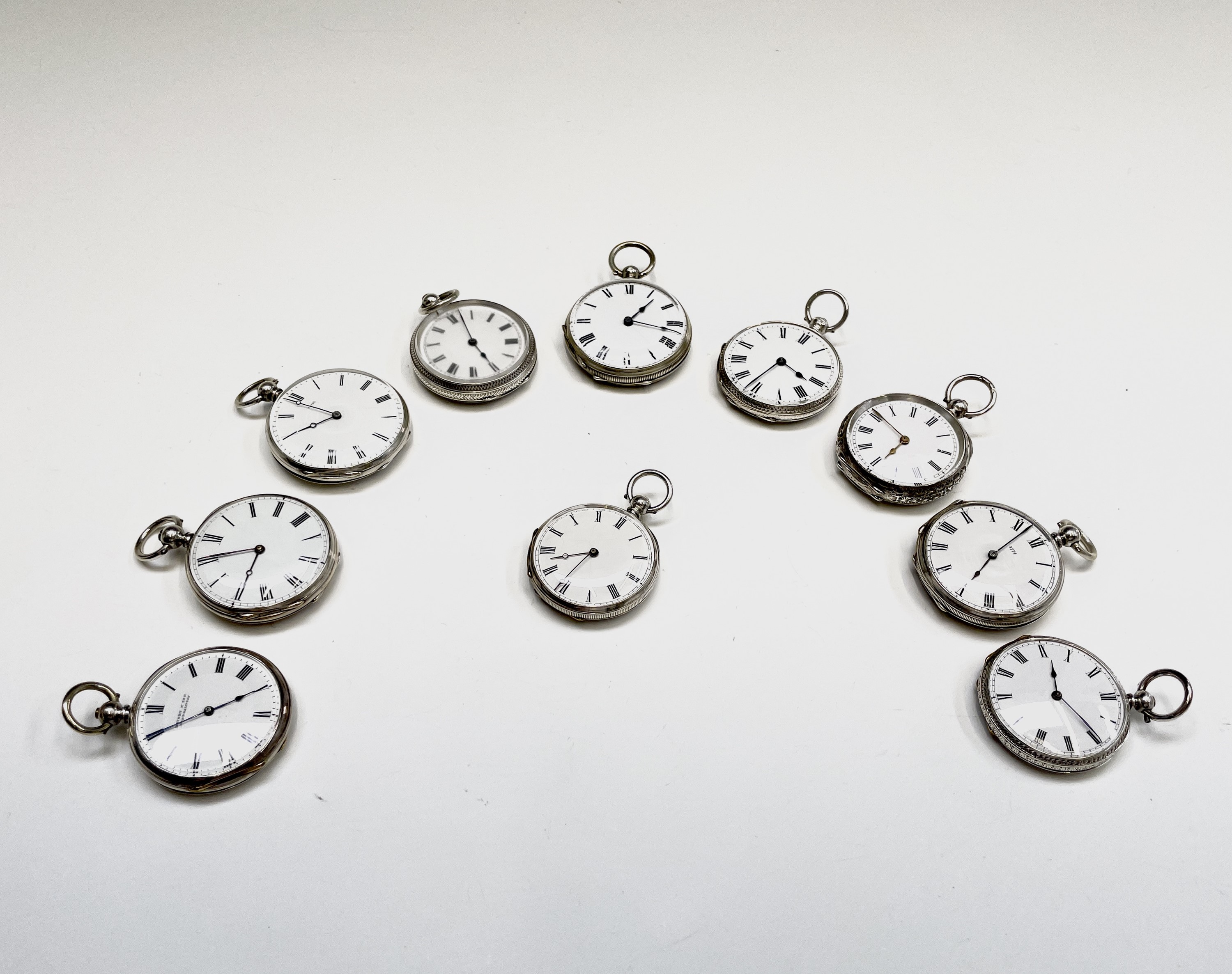 Ten silver cased key-wind fob watches each with plain white open face, the largest is 41mm.