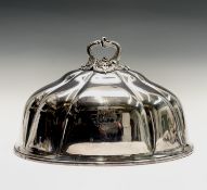 A George IV Sheffield plated meat cover with ornate cast handle and engraved armorial to each side