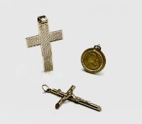 A 9ct gold cross a 9ct gold crucifix and a 10ct gold pendant 10.7gm UK Postage: £15.04