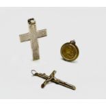 A 9ct gold cross a 9ct gold crucifix and a 10ct gold pendant 10.7gm UK Postage: £15.04