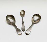 Two silver fiddle pattern caddy spoons each with floral engraved bowl. One with wriggle work by