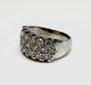 A chunky 18ct white gold ring with nineteen pave set diamonds. 8.4gm Size Q1/2-R. Condition: