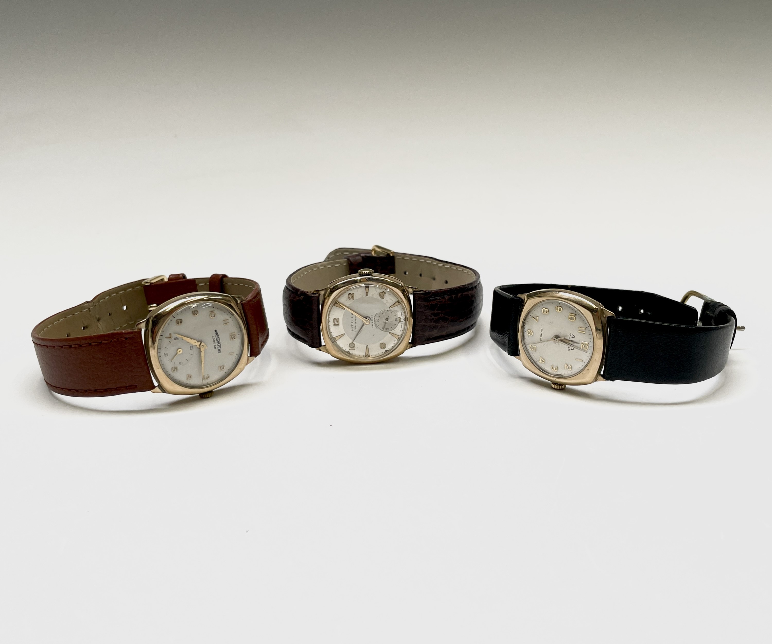 Three 9ct gold cased wristwatches each with rounded square case. Nitella, Winegartens and Avia.