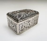 An Edwardian silver ornate cigarette box, Birmingham 1903 Makers mark worn, 13cm wide Condition: