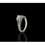 A pretty18ct white gold diamond set ring, the principle stone a princess cut of 0.51ct, clarity SI2,