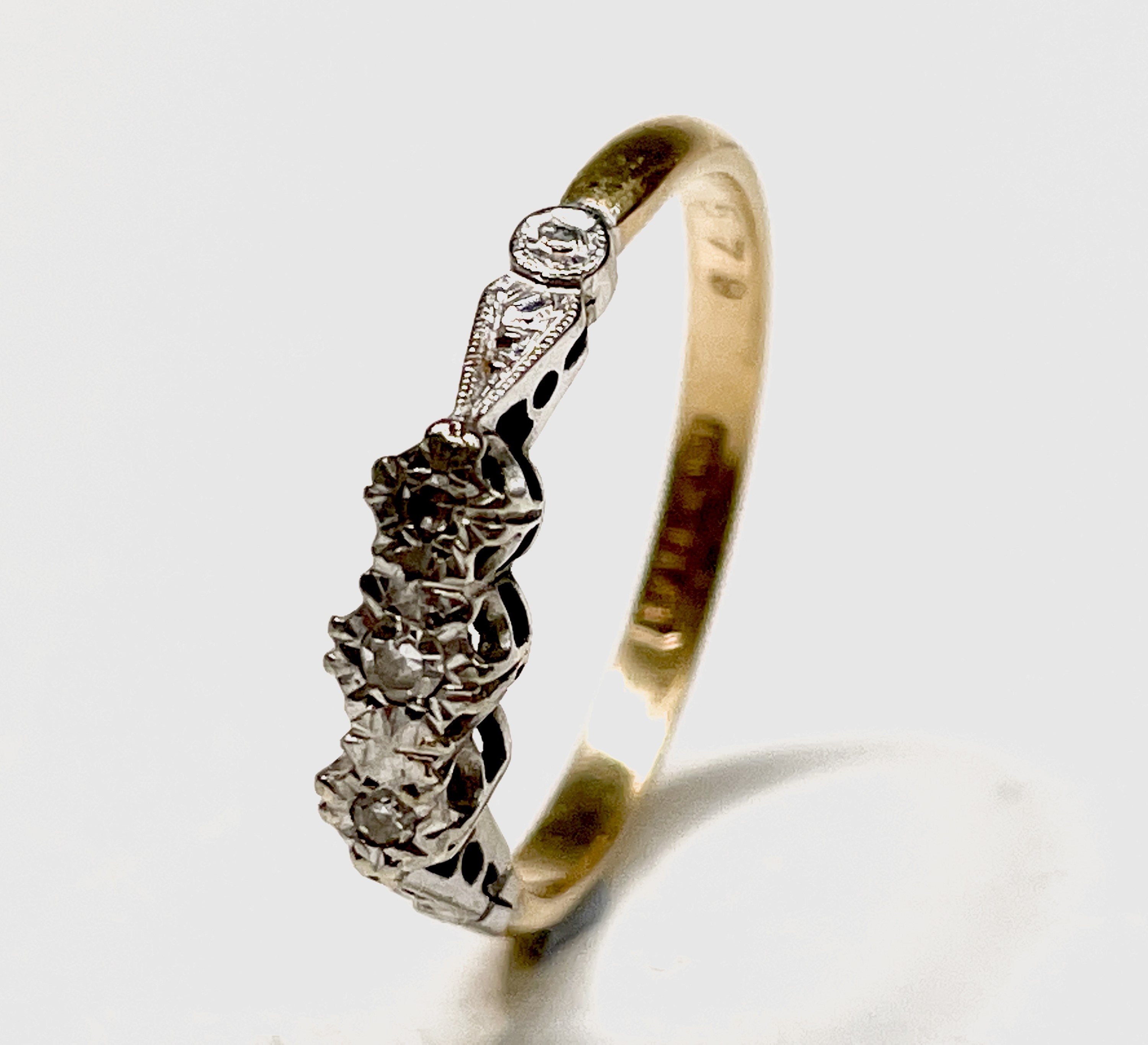 An 18ct gold three stone diamond ring 2.4gm size N and a gold eternity ring 3.3gm size L UK Postage: - Image 2 of 7