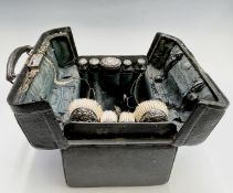 An Edwardian black leather toilet case with silver mounts hallmarked 1901 and 1902 Condition: The