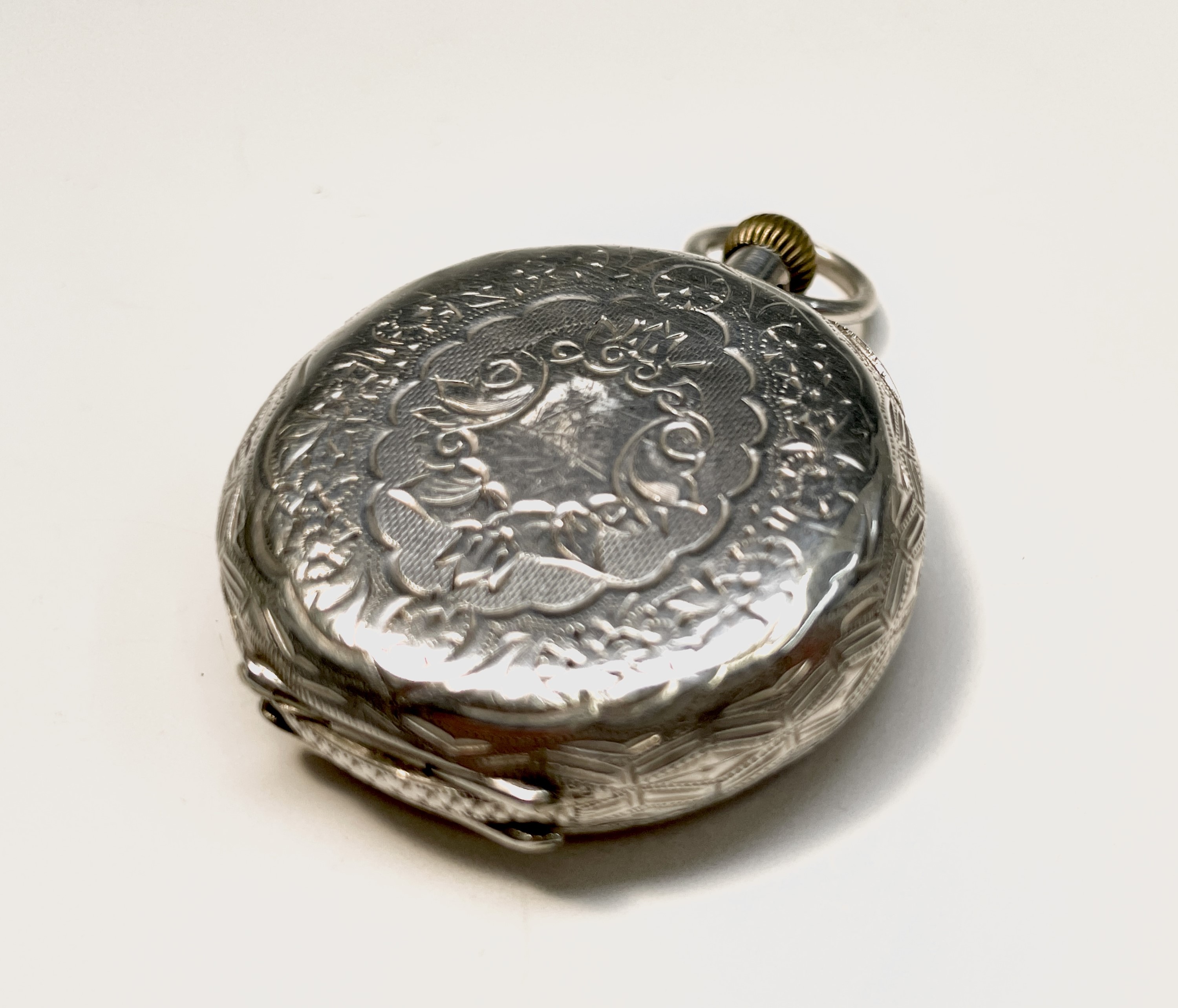 Ten silver cased keyless fob watches each with an ornamental dial and each with engraved decoration. - Image 37 of 60