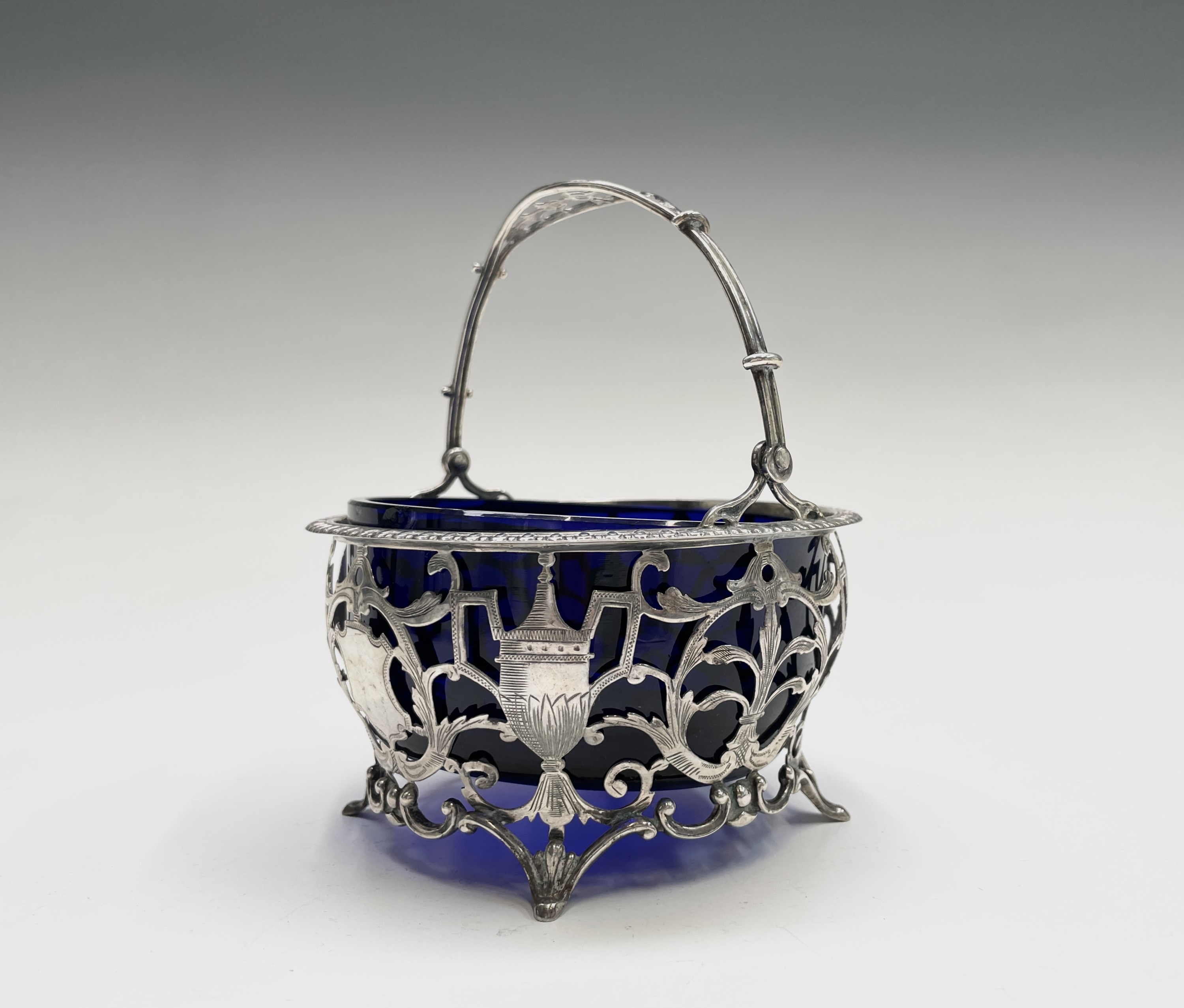 A silver sugar bowl by Goldsmiths & Silversmiths Co Ltd, pierced and engraved in revivalist style,