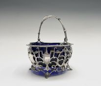 A silver sugar bowl by Goldsmiths & Silversmiths Co Ltd, pierced and engraved in revivalist style,