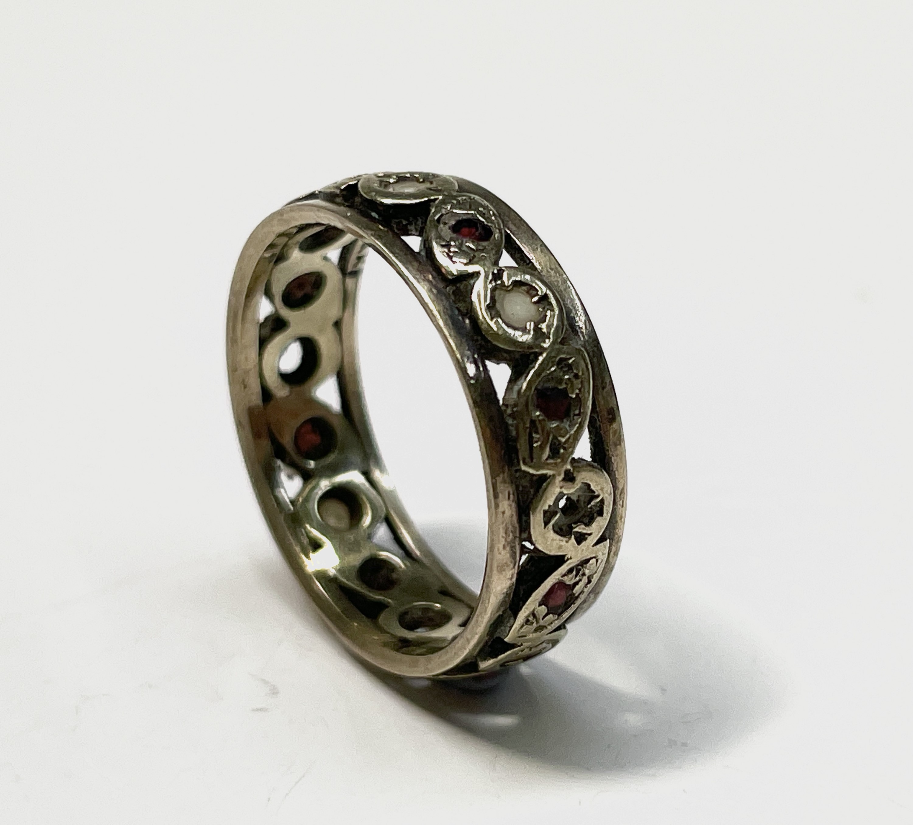 An 18ct gold three stone diamond ring 2.4gm size N and a gold eternity ring 3.3gm size L UK Postage: - Image 3 of 7