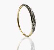 A contemporary 9ct gold hinged bangle wreathed with pave set white and pink diamonds 63x54 internal.