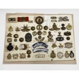South Africa. A display card containing cap badges, collar dogs, shoulder titles and buttons.