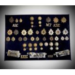 Royal Army Service Corps / Royal Corps of Transport. A display card containing cap badges, collar