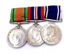 Police Medal Trio. Comprising: Long Service Medal (Queen Elizabeth) and Defence and War Medals