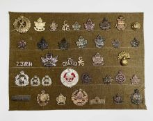 Canadian Expeditionary Forces 43-112 Battalions. A display card containing cap badges, collar