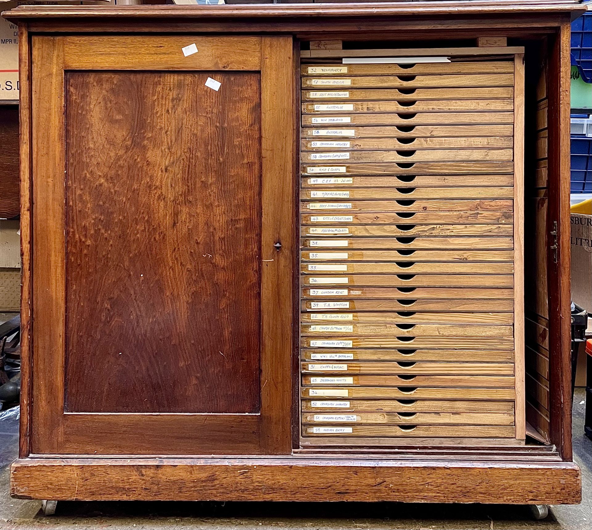 A collector's cabinet with 56 handmade drawers, ideal for displaying badges, buttons, coins etc.