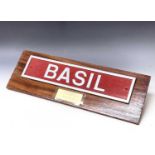 Railwayana - Nameplate "Basil". A mounted nameplate "Basil" (length 22" x 5") together with