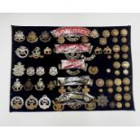 English Regiments - 31st-37th Foot. A display card containing cap badges, collar dogs, shoulder