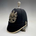 Cornwall Regiments: First Cornwall Artillery Volunteers. A helmet displaying the above badge with