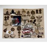 Territorial / RFA and Home Guard. A display card containing cap badges, collar dogs, shoulder titles