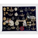 London Regiments - 2. A display card containing cap badges, collar dogs, shoulder titles and