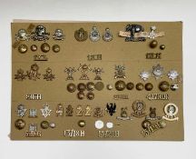 17th Lancers to 15th/19th Hussars. A display card containing cap badges, collar dogs, shoulder