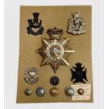 Shako Plate, Cap Badges and Buttons. A mainly 19th century card including South Devon Regiment of