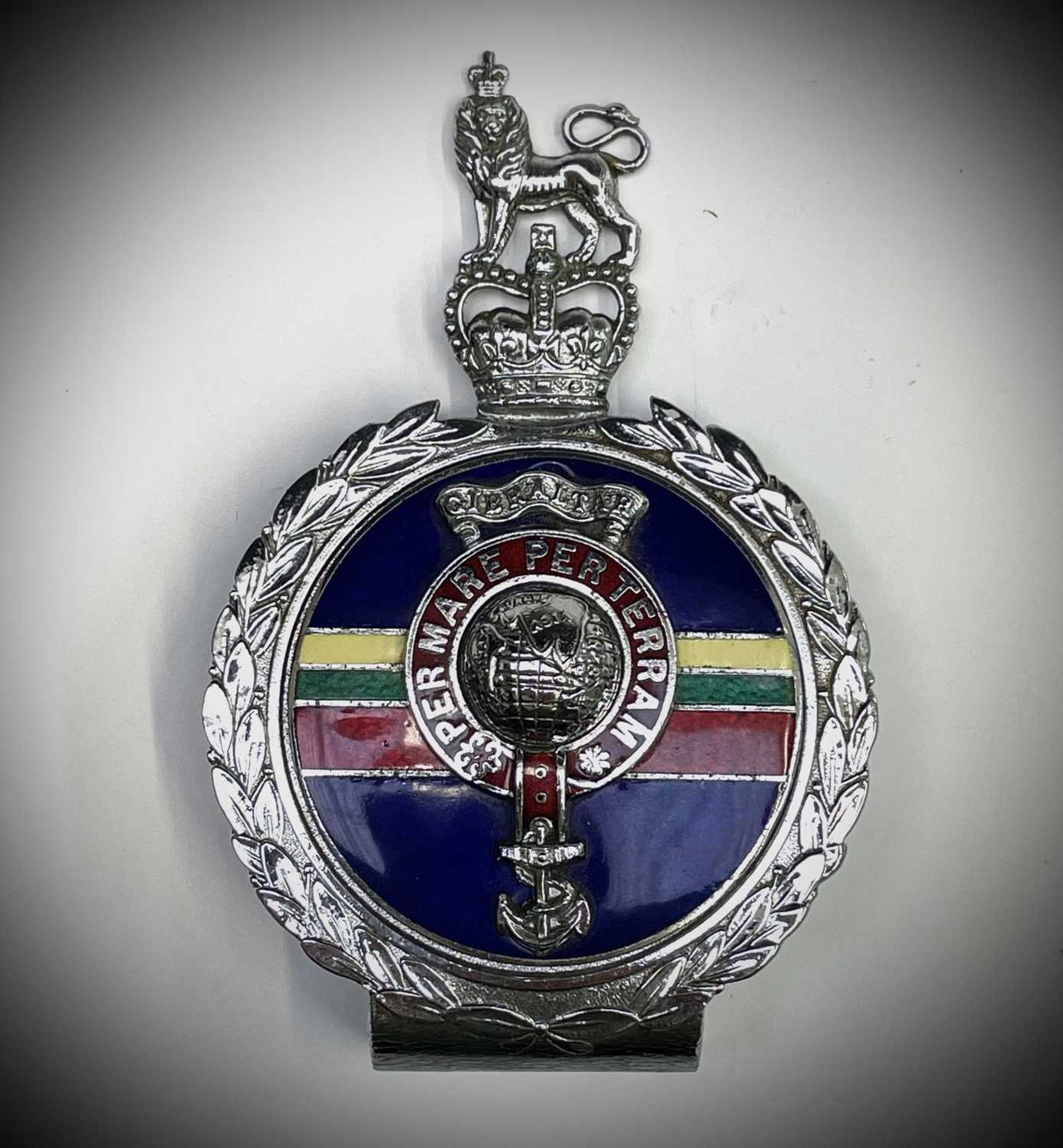 Royal Marines Car Badge. A Yorkshire Tea tin containing: A Royal Marines Car Badge by J R Gaunt in