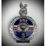 Royal Marines Car Badge. A Yorkshire Tea tin containing: A Royal Marines Car Badge by J R Gaunt in
