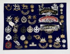 Territorial Army County Regiments. A display card containing cap badges, collar dogs, shoulder