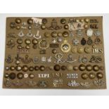 Indian Army. A display card containing cap badges, collar dogs, shoulder titles and buttons. An